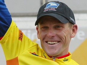 US cyclist Lance Armstrong waves from the winners' podium, 26 May 2002, after he won the 54th Midi-Libre Grand prix race.