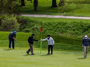 A group of people play a round of golf at the Don Valley Golf Course during a phased reopening from the coronavirus disease (COVID-19) restrictions in Toronto, Ontario, Canada May 19, 2020.