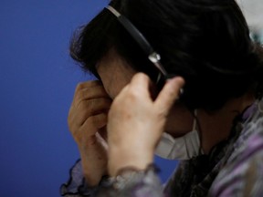 A volunteer responds an incoming call at the Tokyo Befrienders call center, a Tokyo's suicide hotline center, during the spread of the coronavirus disease (COVID-19), in Tokyo, Japan May 26, 2020.