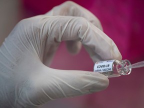 A researcher works inside a laboratory of Chulalongkorn University during the development of an mRNA type vaccine candidate for the coronavirus disease (COVID-19) in Bangkok, Thailand, May 25, 2020.