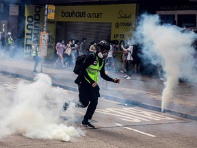 Police fire tear gas on protesters during a planned protests against a proposal to enact a new security legislation in Hong Kong on May 24, 2020.