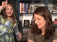 Tina Fey's daughter, Penelope, interrupts her interview with Seth Meyers on his show, then stares straight into the camera and slowly moved her hand to her forehead - making the shape of a “L” with her thumb and forefinger.