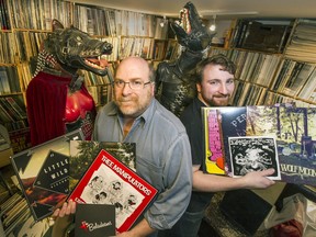 Neptoon Records owner Rob Frith (left, with his son, Ben) with some of the albums in the basement of their store in Vancouver on Oct. 24, 2014.