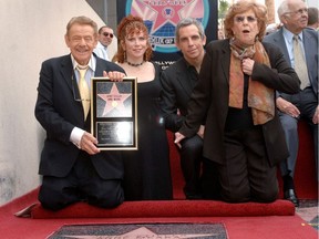 Brother and sister Amy (2nd L) and Ben Stiller (2nd R) pose for pictures at a ceremony where their parents Jerry Stiller and Anne Meara are honored with a star on the Hollywood Walk of Fame in Los Angeles, California February 9, 2007.