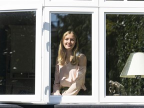 Jessica Lau looks out of window of her home in Vancouver.