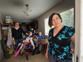 Carmen Aguilera with husband Jocsan Diaz and daughters Amy, 11, and Lucy, 13, at their home in Port Coquitlam.