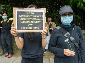 Anti-Chinese government protesters outside the Consulate General of the People's Republic of China in Vancouver on Sunday.