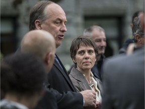 Sonia Furstenau listens to Andrew Weaver at a press conference at the BC legislature in May, 2017.