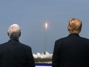 U.S. President Donald Trump and U.S. Vice President Mike Pence watch the launch of a SpaceX Falcon 9 rocket and Crew Dragon spacecraft on NASA's SpaceX Demo-2 mission to the International Space Station from NASA's Kennedy Space Center in Cape Canaveral, Florida, U.S.  May 30, 2020. REUTERS/Jonathan Ernst