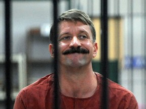 Russian arms dealer Viktor Bout sits in a cell at the Criminal Court in Bangkok on August 11, 2009.