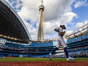 Bo Bichette of the Toronto Blue Jays runs on the field prior to an American League game at Rogers Centre, with the CN Tower in the background, in August 2019.