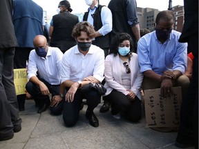 Prime Minister Justin Trudeau takes a knee during a Black Lives Matter protest on Parliament Hill recently.