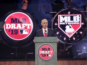 Major League Baseball Commissioner Rob Manfred, already dealing with the COVID-19 crisis, is struggling to strike a deal with players to salvage some kind of season.