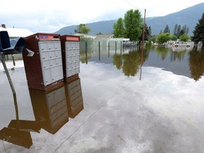Canada Post mailboxes are submerged in the floodwaters in Grand Forks, B.C., on Thursday, May 17, 2018. New today are additional evacuation orders around Grand Forks, bringing the total number of orders in that Boundary city to 189.