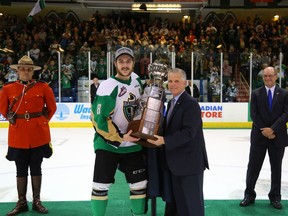 Prince Albert Raiders captain Clayton Pachal accepts the Ed Chynoweth Cup last may from WHL commissioner Ron Robison after beating the Vancouver Giants in the WHL Final.