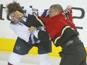 Calgary Flame Jarome Iginla connects as he takes on Ryan Kesler during first period NHL action between the Vancouver Canucks and the Calgary Flames in 2006.