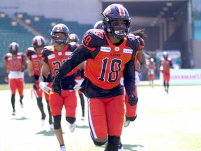 B.C. Lions defensive back Hakeem Johnson runs onto the field before a game against the Saskatchewan Roughriders in 2019.