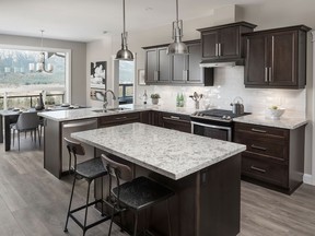 The kitchen is based on a functional triangle layout, and features a handy island, Whirlpool appliances and a walk-in pantry.
