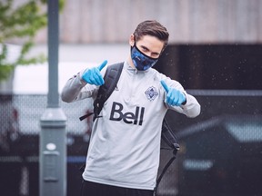 Vancouver Whitecaps right back Jake Nerwinski gives two thumbs up as he arrives at the team's UBC training facility earlier this month. Nerwinski, one of the team's union player representatives, was happy the league and PA finally struck a deal for a new CBA, which will see MLS resume play in July at a tournament in Orlando.