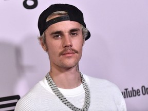 In this file photo, Canadian singer Justin Bieber arrives at the Regency Bruin Theatre in Los Angeles on January 27, 2020.