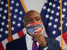 South Carolina Republican Senator Tim Scott adjusts his face mask on Capitol Hill in Washington, D.C., on June 23, 2020.