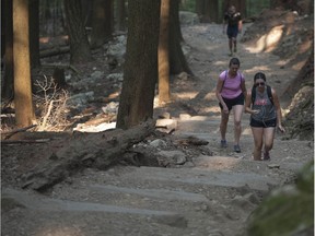 People hike the Grouse Grind trail in North Vancouver, BC's Grouse Mountain Regional Park Wednesday, August 2, 2017.