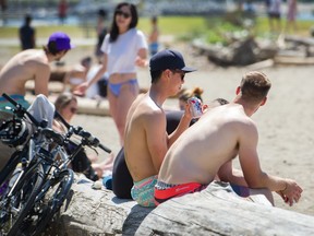 People at English Bay in Vancouver, BC, July 1, 2019.