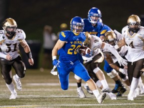 UBC Thunderbirds running back Kory Nagata busts through the hole against the University of Manitoba Bisons during a September 2018 Canada West game at UBC. Nagata, 24, died in a drowning accident on Sunday.