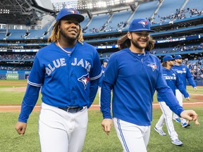 If all goes according to plan, Vladimir Guerrero Jr. (left) and Bo Bichette will practise at the Rogers Centre today.