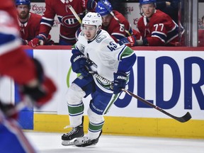 Quinn Hughes of the Vancouver Canucks skates against the Montreal Canadiens during the third period at the Bell Centre on February 25, 2020 in Montreal, Canada. The Vancouver Canucks defeated the Montreal Canadiens 4-3 in overtime.