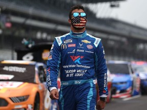 Bubba Wallace, driver of the #43 World Wide Technology Chevrolet, walks the grid prior to the NASCAR Cup Series Big Machine Hand Sanitizer 400 Powered by Big Machine Records at Indianapolis Motor Speedway on July 05, 2020 in Indianapolis, Indiana.