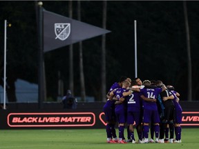 Members of Orlando City huddle before a match against Inter Miami as part of the MLS is Back Tournament at the ESPN Wide World of Sports Complex on Thursday in Reunion, Fla. The 'hosts' of the tournament beat Inter Miami 2-1 on a last-second goal by Nani.