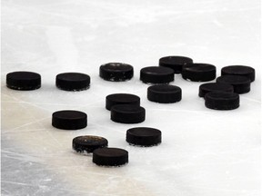 Hockey stock photo. LAS VEGAS, NEVADA - JULY 22:  Hockey pucks are gathered on the ice during a training camp practice for the Vegas Golden Knights at City National Arena on July 22, 2020 in Las Vegas, Nevada.  (Photo by Ethan Miller/Getty Images) ORG XMIT: 775538209