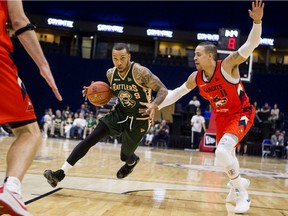 Saskatchewan Rattlers guard Gentrey Thomas drives the ball under pressure from Fraser Valley Bandits guard Joel Friesen during a 2019 game in Saskatoon. The Rattlers won the inaugural season of the CEBL.