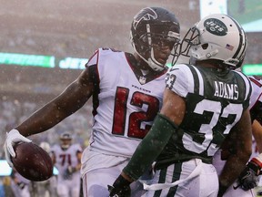 Wide receiver Mohamed Sanu #12 of the Atlanta Falcons celebrates his touchdown against strong safety Jamal Adams #33 of the New York Jets in 2017. Adams has been traded to the Seattle Seahawks.