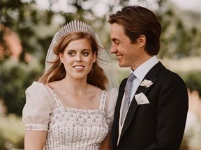Britain's Princess Beatrice and Edoardo Mapelli Mozzi are seen in the grounds of the Royal Lodge after their wedding, in Windsor, Britain, in this official wedding photograph released by the Royal Communications on July 19, 2020.
