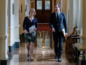 Provincial Health Officer Dr. Bonnie Henry walks with B.C Health Minister Adrian Dix.