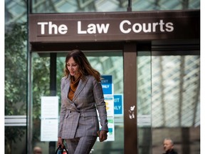 Eileen Mohan, whose 22-year-old son Chris was killed along with five other people at a Surrey, B.C., high rise in 2007, leaves B.C. Supreme Court in Vancouver, on Thursday, July 9, 2020.