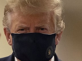 U.S. President Donald Trump wears a mask while visiting Walter Reed National Military Medical Center in Bethesda, Maryland, U.S., July 11, 2020.