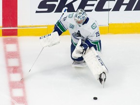 Vancouver Canucks goaltender Jacob Markstrom (25) stretches during warm-up prior to NHL exhibition game action against the Winnipeg Jets in Edmonton, on Wednesday, July 29, 2020.