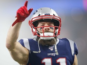 New England Patriots wide receiver Julian Edelman (11) points to the crowd before a game against the Tennessee Titans at Gillette Stadium.