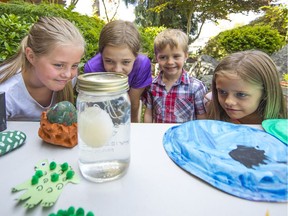 Four of the Gazzola children, Bridget, Cate, Anthony, and Anne, pass their time with crafts and projects.