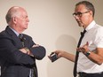 MLA Garry Begg chats with condo marketer Bob Rennie after a panel discussion in Surrey on Thursday.