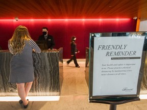 Covid-19 regulations implemented at front desk inside Fairmont Pacific Rim in Vancouver, B.C., June 23, 2020.
