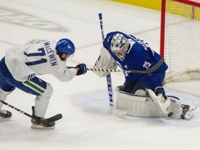Zack MacEwen fires a shot on Jacob Markstrom during a Vancouver Canucks practice at Rogers Arena this week.