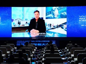 Tesla Inc Chief Executive Officer Elon Musk is seen on a screen during a video message at the opening ceremony of the World Artificial Intelligence Conference (WAIC) in Shanghai, Thursday.
