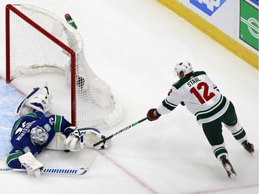Eric Staal #12 of the Minnesota Wild tries to score a goal as Jacob Markstrom #25 of the Vancouver Canucks defends the net in Game One of the Western Conference Qualification Round prior to the 2020 NHL Stanley Cup Playoffs at Rogers Place on August 02, 2020 in Edmonton, Alberta, Canada.