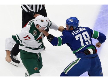 Marcus Foligno #17 of the Minnesota Wild fights with Micheal Ferland #79 of the Vancouver Canucks in Game One of the Western Conference Qualification Round prior to the 2020 NHL Stanley Cup Playoffs at Rogers Place on August 02, 2020 in Edmonton, Alberta, Canada.