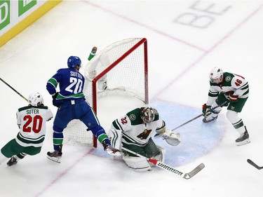 Alex Stalock #32 of the Minnesota Wild and Jared Spurgeon #46 of the Minnesota Wild defend the net against Brandon Sutter #20 of the Vancouver Canucks in Game One of the Western Conference Qualification Round prior to the 2020 NHL Stanley Cup Playoffs at Rogers Place on August 02, 2020 in Edmonton, Alberta, Canada.