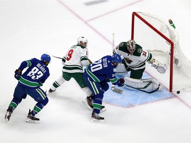 Alex Stalock #32 of the Minnesota Wild stops a shot from Brandon Sutter #20 of the Vancouver Canucks in Game One of the Western Conference Qualification Round prior to the 2020 NHL Stanley Cup Playoffs at Rogers Place on August 02, 2020 in Edmonton, Alberta, Canada.
